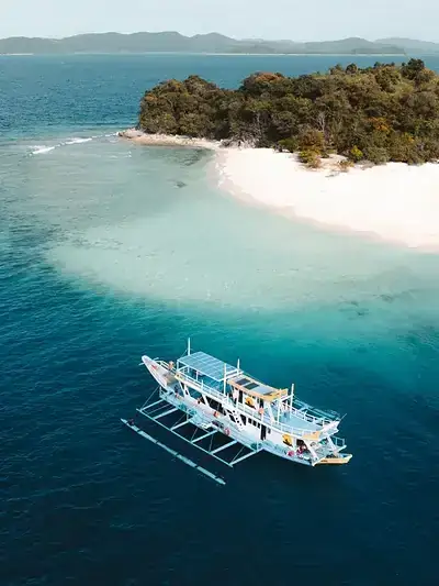 Seatours expedition boat anchored at a private Linapacan island