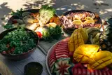 Fresh grilled seafood, salad, and tropical fruit served during a Seatours private speedboat charter in El Nido